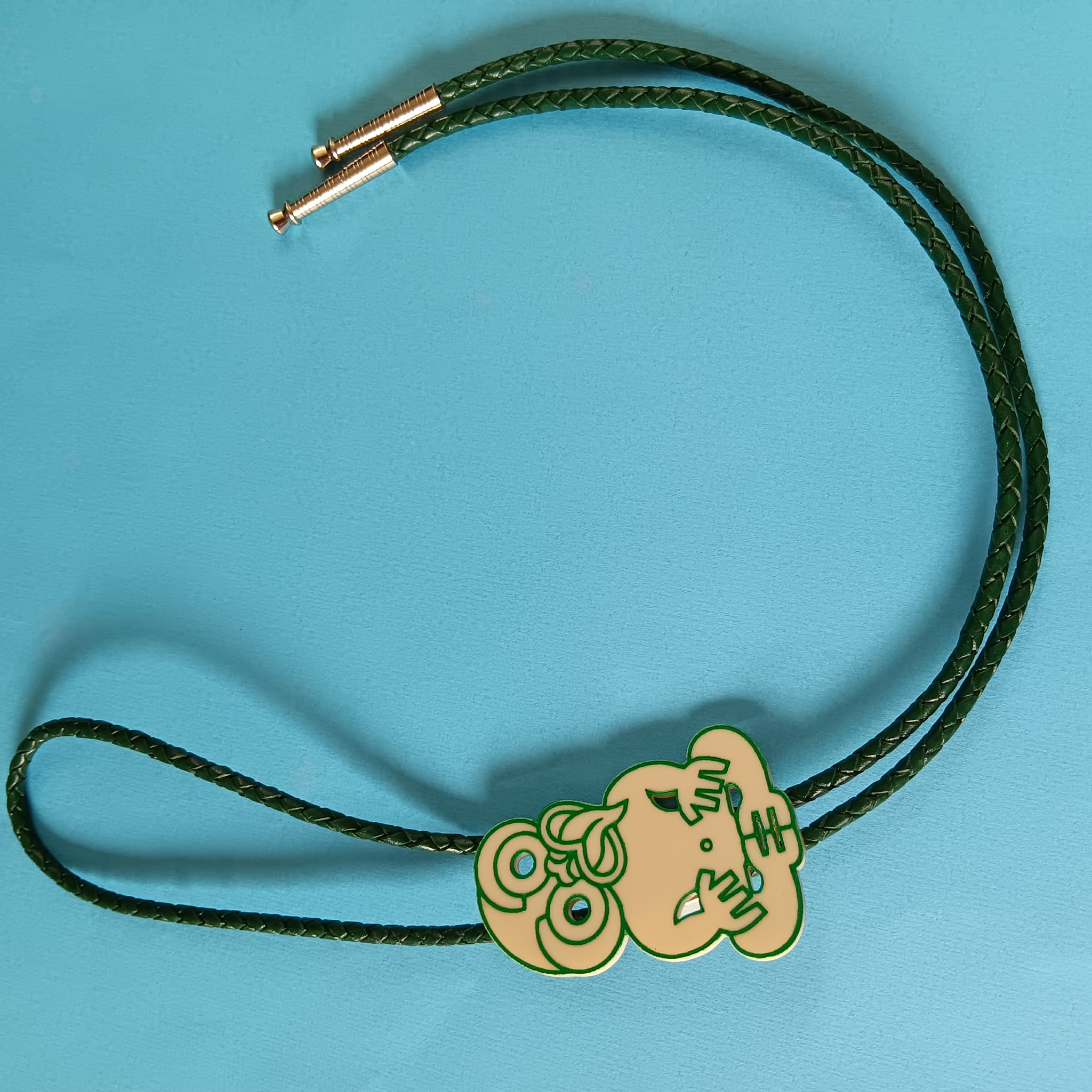 TIKI BOLO TIE - GREEN LEATHER CORD